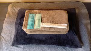 a box with two toothbrushes sitting on a table at TONARINO Backpackers Hostel Free Breakfast in Kobe +44 photos