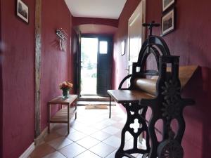 a hallway with a room with red walls at Historic Apartment in Gerdshagen with Garden in Gerdshagen +81 photos