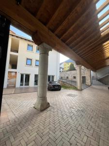 a car parked under a pavilion in a building at A Casa di Angelica in Piovene Rocchette +4 photos