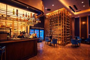 a bar in a restaurant with a man sitting at a counter at klcc Star residence Kuala Lumpur in Kuala Lumpur