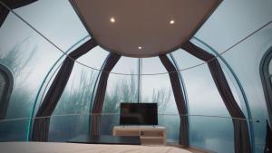 a room with a window with a computer in it at Arkaluna Resort & Adventure in Kintamani