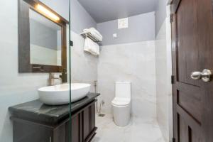 a bathroom with a sink and a toilet at Karanda Eco Resort in Dambulla