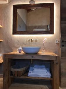 a bathroom with a sink and a mirror at Il Glicine - Natural BnB in Castello di Godego +123 photos
