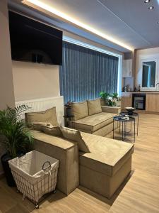 a living room with a couch and a table at Anestis Studios in Lidia