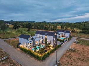 an aerial view of a house with a swimming pool at I-DIN POOL VILLA khaoyai in Ban Nong Song Hong
