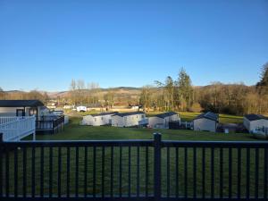 a view of a park from a fence at Luxury static caravan in Beattock
