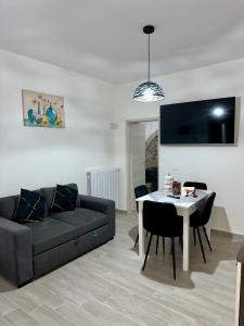a living room with a couch and a table at Residenza Ohana in Isernia