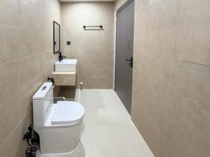 a bathroom with a toilet and a sink at Hiraya Guesthouse in Ukulhas +11 photos