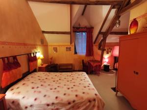 a bedroom with a large bed in a room at La Mérais in Marsac-sur-Don