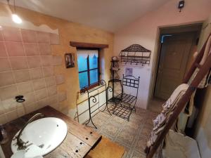a bathroom with a sink and a mirror at La Mérais in Marsac-sur-Don +16 photos
