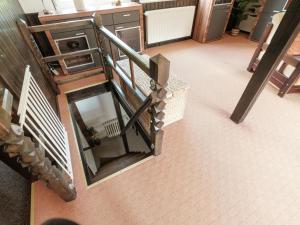 an overhead view of a staircase in a building at Quaint Holiday Home in Elbingerode near Forest in Neuwerk