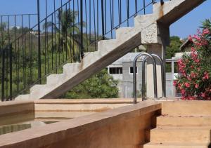 a set of stairs leading up to a building at Casa Ampa Zikatela- Brisas de Zicatela- Puerto Escondido in Brisas de Zicatela