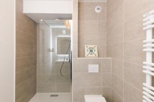 a bathroom with a shower and a toilet at Féeries Provençales YourHostHelper in Grimaud +11 photos