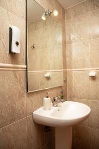 a bathroom with a sink and a mirror at Castle House Xativa in Xàtiva +37 photos