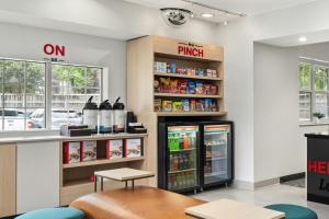 a fast food restaurant with an open refrigerator at TownePlace Suites Chicago Lombard in Lombard