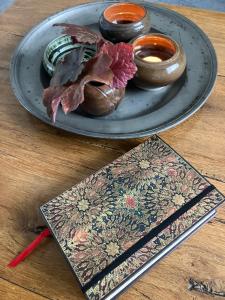 a plate of food on top of a wooden table at B&B My Suite Home in Bruges