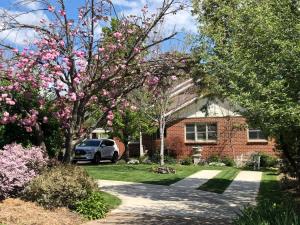 a house with a car parked in the driveway at Coorabin in Orange
