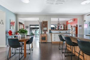 a kitchen and dining room with a table and chairs at Coorabin in Orange
