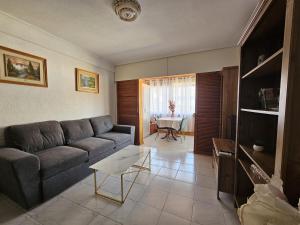 a living room with a couch and a table at Apartament La Mata in La Mata