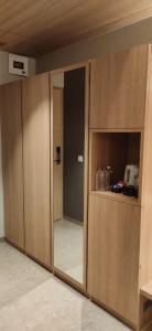 ajar doors in a room with a kitchen at Kratos Lifestyle in Surat +39 photos