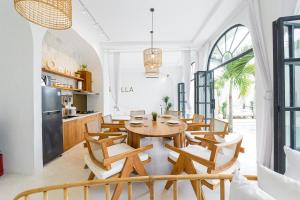 a kitchen and dining room with a wooden table and chairs at 5BR Ocen View Villa in Jimbaran in Jimbaran