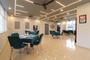 a dining room with a table and chairs at Hotel RP Residency in Nakraunda