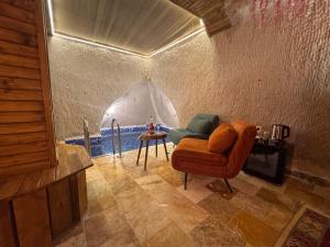 a living room with a couch and a table at Ceran Stone House in Göreme