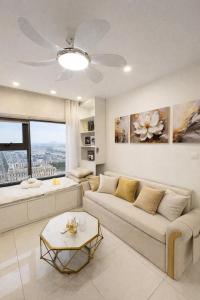 a living room with a couch and a table at Luxury 1BR Apartment - Ocean Lake View - Vinhomes Ocean Park in Gia Lâm Pho +16 photos