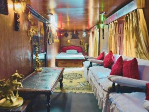a train room with two beds and a table at Newa Home Bhaktapur in Bhaktapur