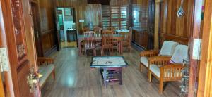 an overhead view of a dining room with a table and chairs at JackRoot Athirappilly in Kallana