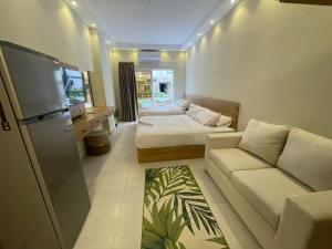 a small living room with a bed and a couch at Florenza Resort- Hurghada in Hurghada +182 photos