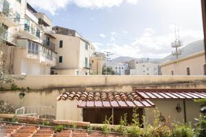 a view of a building with buildings at Cefalù Beach Garden House in Cefalù