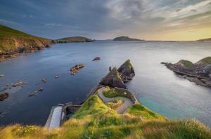 a view of a body of water with rocks at Pier House Luxury Apartment in Dingle +13 photos