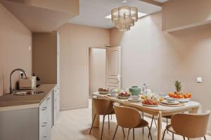 a kitchen with a table with food on it at French house in Paris