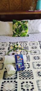 a pile of toilet paper sitting on top of a bed at Green Sea Turtle in Romblon