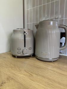 two toasters sitting next to each other on a counter at Maple Gem in Birmingham