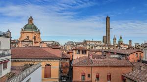 a view of a city with mosques and roofs at Cavour Suite Luxury in Bologna
