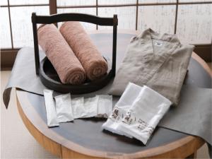 a table with rolls of paper and towels on it at Shirahama no Yado Daigo in Shirahama +137 photos