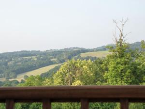 uitzicht op het landschap vanaf het terras van een huis bij Spacious holiday home in Sussac with pool in Châteauneuf-la-Forêt