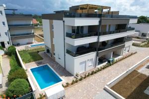 an aerial view of a building with a swimming pool at Starview in Privlaka