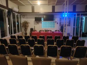 a conference room with a table and chairs at Dago Hotel Salon FORA in Bandung