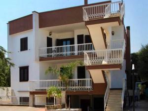 a building with balconies on the side of it at La Maison du Coeur in Bari