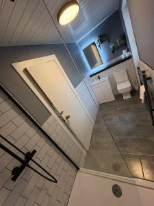 an overhead view of a bathroom with a toilet at The Covenanter Hotel in Falkland +26 photos