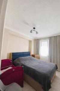 a bedroom with a bed and a window at Welcome2 in Kobuleti