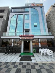 a building with a sign on the front of it at Hotel SK Chakan Pune in Dehu
