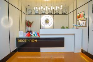 a reception desk in a room with a fireplace at Milliy Hotel - Namangan city in Namangan