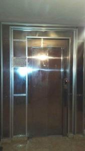 a elevator door in a building with a light on it at marhaba apartement in Oujda