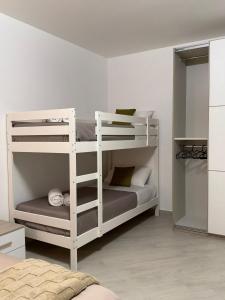 a bedroom with two bunk beds in a room at Trinacria Rooms 2 in Carini