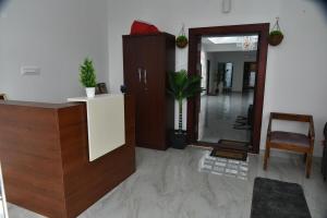 a living room with a hallway with a mirror at Shans Valley in Kotagiri