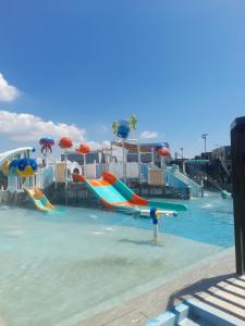 a water park with slides in the water at Casa Joseph in Aga